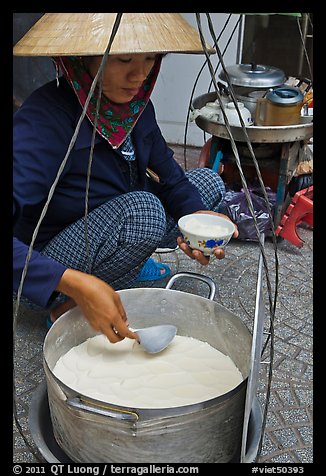 Woman serving a bowl of soft tofu. Ho Chi Minh City, Vietnam