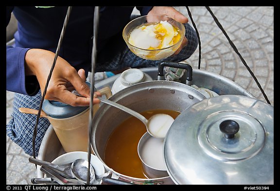 Sirup added to a bowl of soft tofu. Ho Chi Minh City, Vietnam (color)