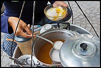 Sirup added to a bowl of soft tofu. Ho Chi Minh City, Vietnam