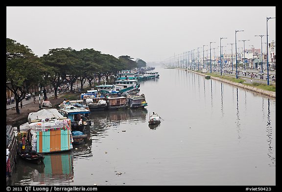 Cargo boats moored on Saigon Arroyau. Cholon, Ho Chi Minh City, Vietnam (color)