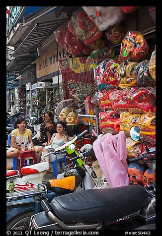 Store selling traditional dragon masks. Cholon, Ho Chi Minh City, Vietnam (color)