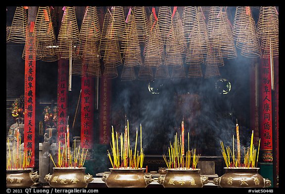 Urns, incense coils, and incense smoke, Thien Hau Pagoda. Cholon, District 5, Ho Chi Minh City, Vietnam