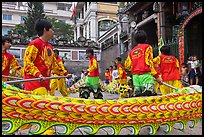 Dancers animating dragon, Thien Hau Pagoda, district 5. Cholon, District 5, Ho Chi Minh City, Vietnam (color)