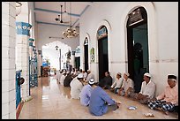 Men sharing food in gallery, Cholon Mosque. Cholon, District 5, Ho Chi Minh City, Vietnam ( color)