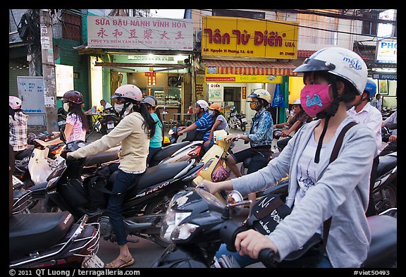 Commuters on motorcyles in stopped traffic. Ho Chi Minh City, Vietnam