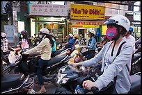 Commuters on motorcyles in stopped traffic. Ho Chi Minh City, Vietnam