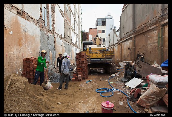 Buiding in construction in narrow space. Ho Chi Minh City, Vietnam (color)