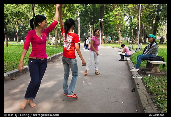 Young women practising dance, Cong Vien Van Hoa Park. Ho Chi Minh City, Vietnam (color)
