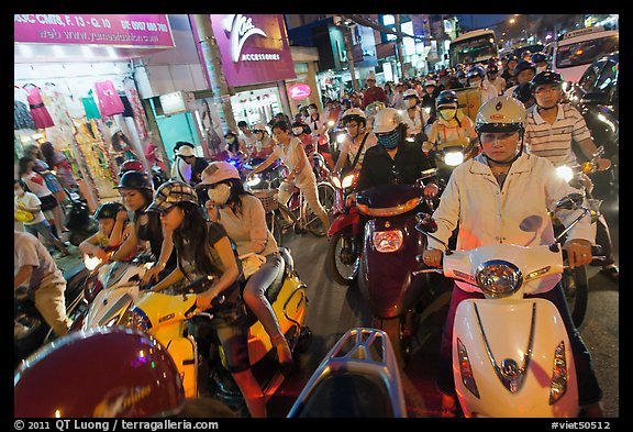 Street filled with motorcycles at rush hour. Ho Chi Minh City, Vietnam (color)