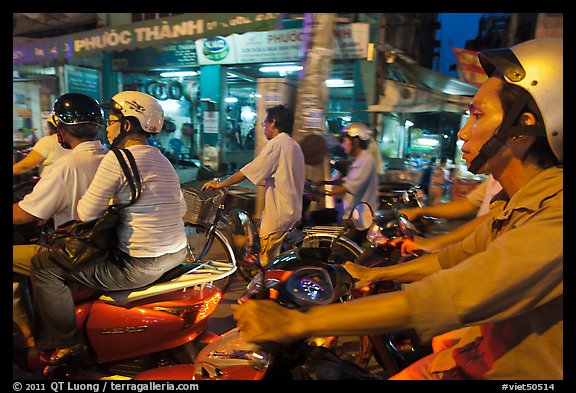 Motorcyle riders in traffic gridlock. Ho Chi Minh City, Vietnam (color)