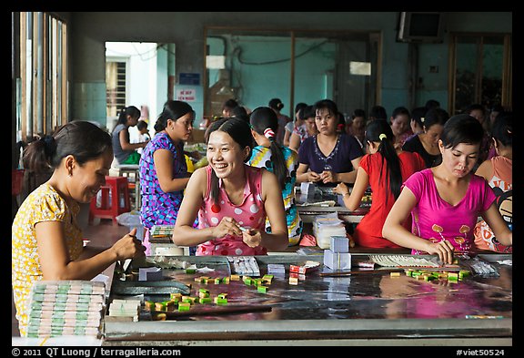 Productin of candy through manual labor. Ben Tre, Vietnam (color)