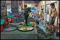 Pots in cococut candy factory. Ben Tre, Vietnam