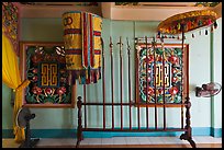 Rack with lamp, unbrella, lances, Saigon Caodai temple, district 5. Ho Chi Minh City, Vietnam