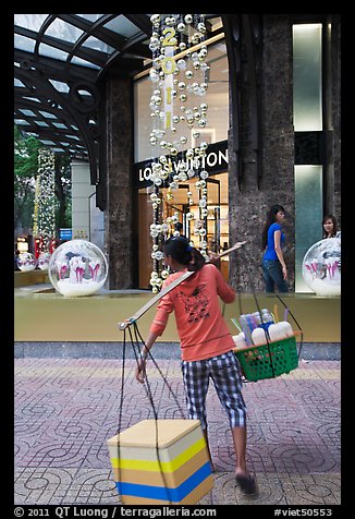 Food vendor and luxury store. Ho Chi Minh City, Vietnam (color)