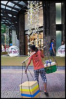 Food vendor and luxury store. Ho Chi Minh City, Vietnam (color)