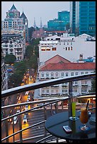 Drinks and view from rooftop bar of Hotel Caravelle. Ho Chi Minh City, Vietnam (color)