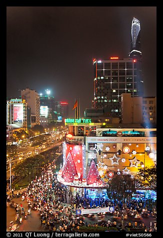 Cityscape elevated view at night with dense traffic on streets. Ho Chi Minh City, Vietnam (color)