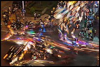 Long exposure traffic trails on busy intersection from above at night. Ho Chi Minh City, Vietnam ( color)