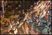 Flow of motorcycle traffic at night from above. Ho Chi Minh City, Vietnam ( color)