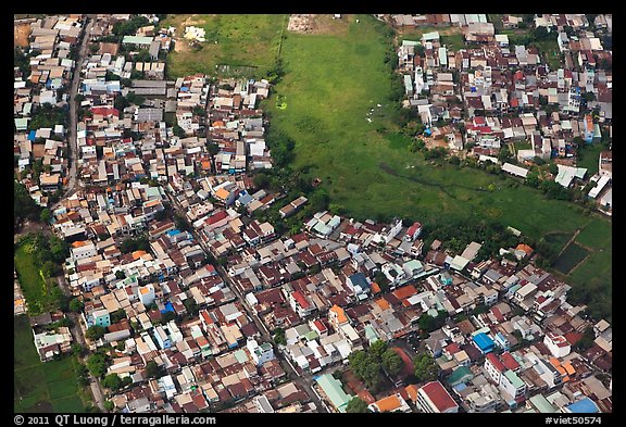 Aerial view of houses and fields on the outskirts of the city. Ho Chi Minh City, Vietnam