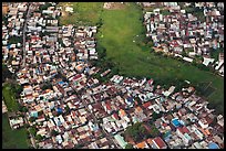 Aerial view of houses and fields on the outskirts of the city. Ho Chi Minh City, Vietnam