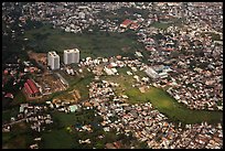 Aerial view of houses and high-rises on the outskirts of the city. Ho Chi Minh City, Vietnam