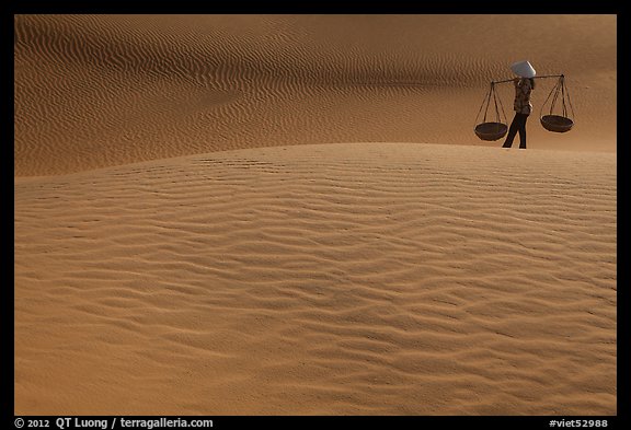 Typical vietnamese figure on Mui Ne dunes. Mui Ne, Vietnam (color)