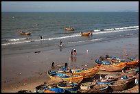 Boats and fishermen on beach. Mui Ne, Vietnam ( color)