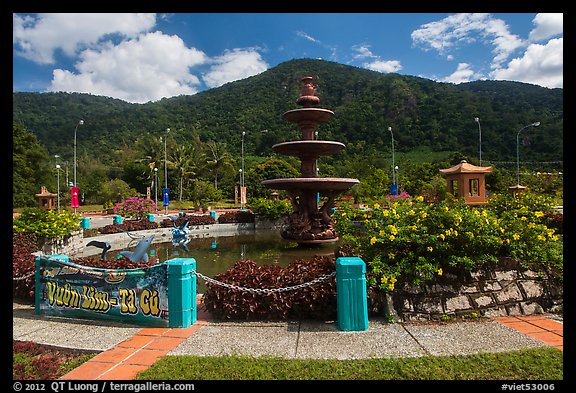 Fountain and forested peak. Ta Cu Mountain, Vietnam