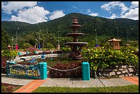 Fountain and forested peak. Ta Cu Mountain, Vietnam (color)