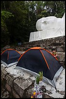 Child and tents set up below head of Buddha statue. Ta Cu Mountain, Vietnam ( color)