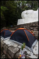 Child and tents set up below head of Buddha statue. Ta Cu Mountain, Vietnam (color)