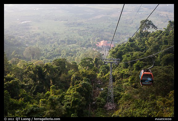 Cable car, tree canopy and plain. Ta Cu Mountain, Vietnam