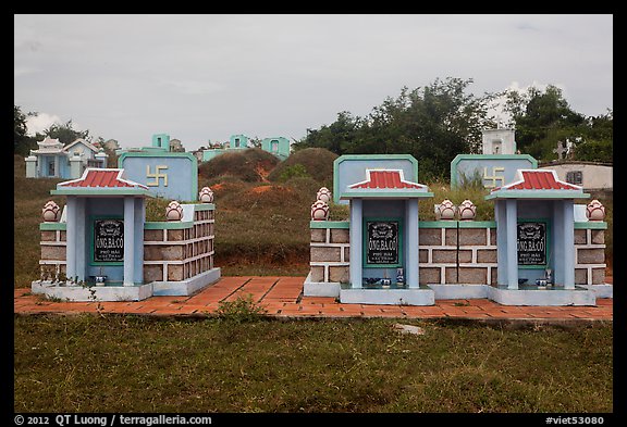 Mix of Buddhist and Christian tombs. Mui Ne, Vietnam