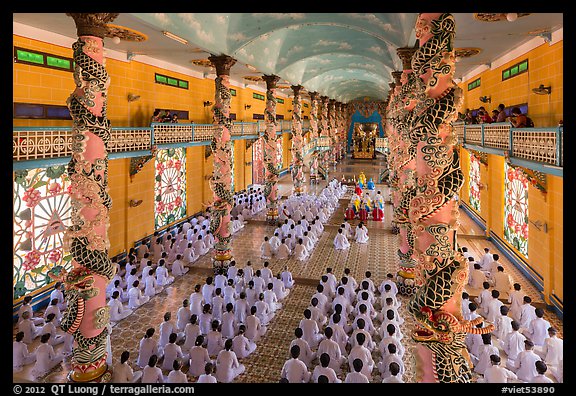 Noon ceremony inside Cao Dai Holy See temple. Tay Ninh, Vietnam