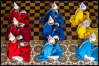 Cao Dai dignitaries wearing red (Confucian), blue (Taois) and yellow (Buddhist). Tay Ninh, Vietnam (color)