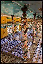 Ceremony inside Great Temple of Cao Dai. Tay Ninh, Vietnam (color)