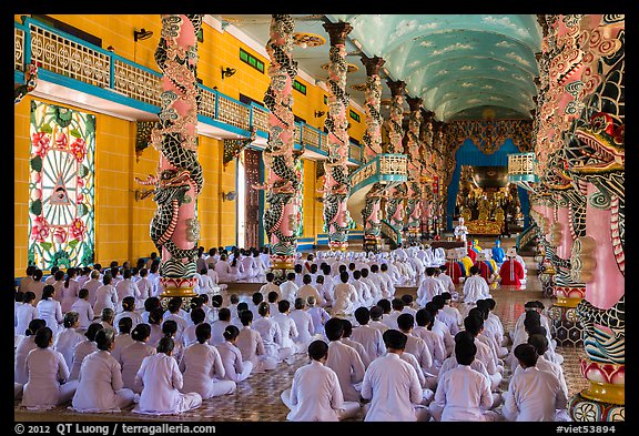 Rows of worshippers in Great Temple of Cao Dai. Tay Ninh, Vietnam