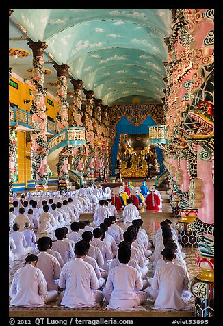 Rows of worshippers in Cao Dai Holy See. Tay Ninh, Vietnam (color)