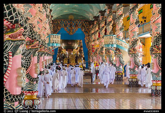 Cao Dai followers during a service inside Holy See. Tay Ninh, Vietnam (color)