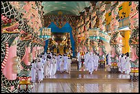 Cao Dai followers during a service inside Holy See. Tay Ninh, Vietnam (color)