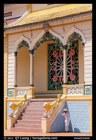 Cao Dai follower and temple detail. Tay Ninh, Vietnam