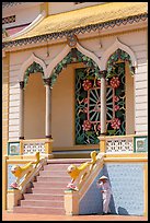 Cao Dai follower and temple detail. Tay Ninh, Vietnam ( color)