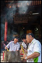 Worshippers burning incense, Thien Hau Pagoda. Cholon, District 5, Ho Chi Minh City, Vietnam ( color)