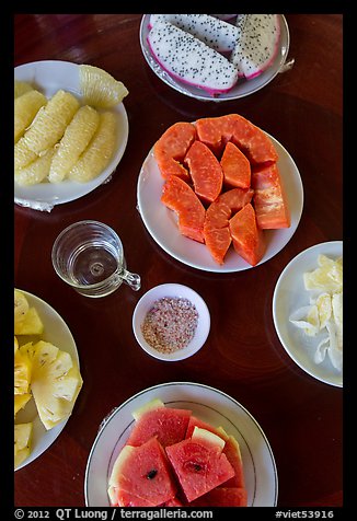 Fresh fruit quartered and served on table, Phoenix Island. My Tho, Vietnam (color)