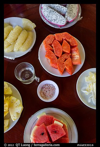 Fresh fruit quartered and served on table, Phoenix Island. My Tho, Vietnam