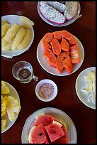 Fresh fruit quartered and served on table, Phoenix Island. My Tho, Vietnam ( color)