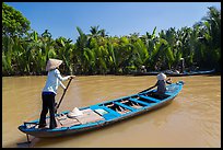 Women row canoes, Phoenix Island. My Tho, Vietnam (color)