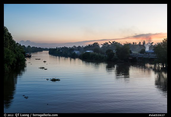 River and homes at sunset. Mekong Delta, Vietnam (color)