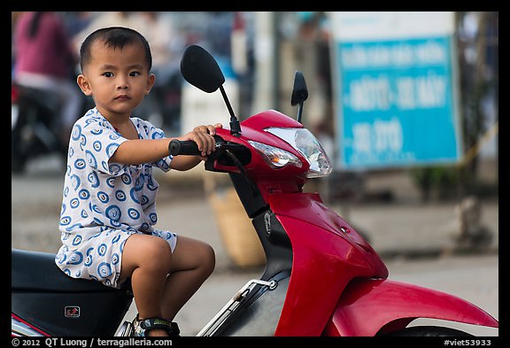 Boy on scooter. Can Tho, Vietnam (color)